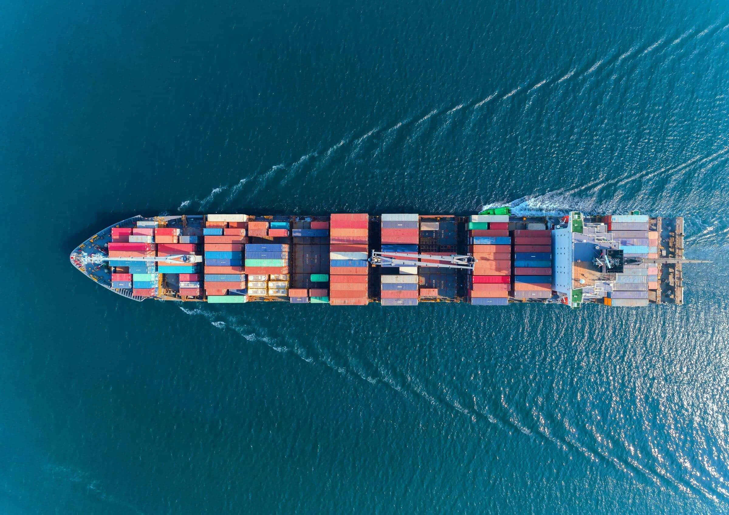 Aerial view of a fully laden container ship underway at sea