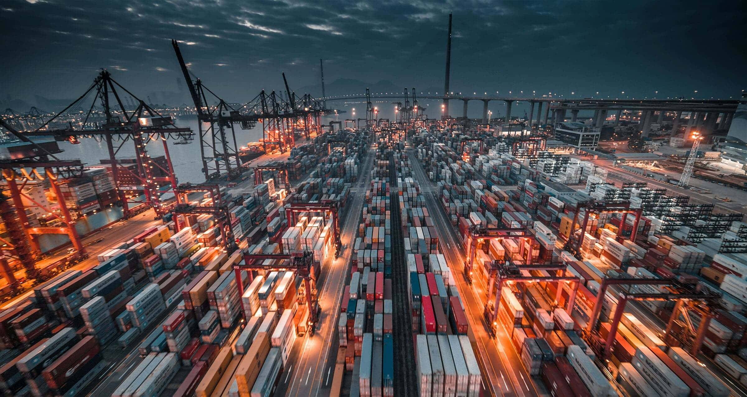 Gantry cranes loading containers onto a vessel at a container terminal